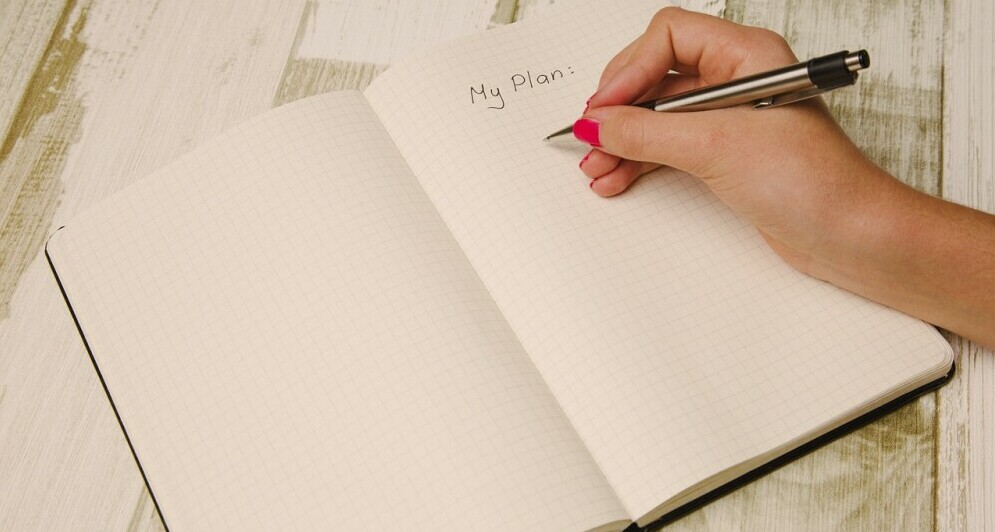 a note book with My Plan written on it
